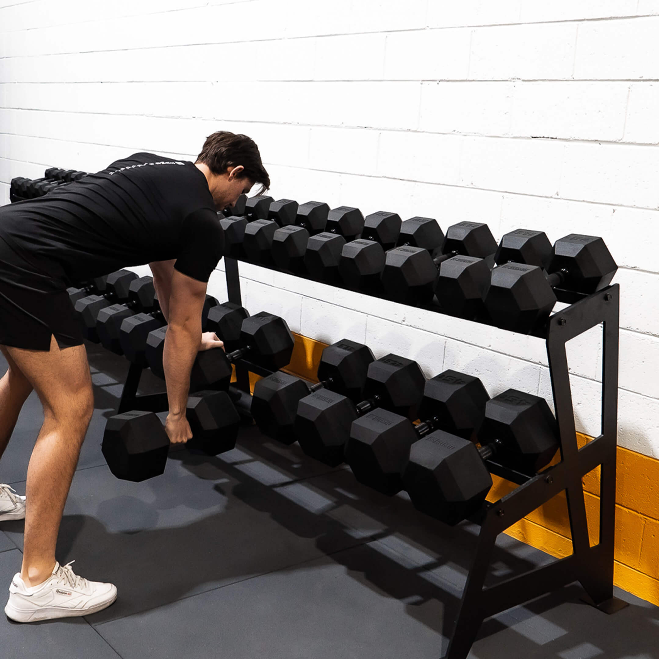 Black Hex Dumbbell Set with Rack (5-45kg) (in use)