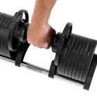 2kg Segment being lifted from 32kg Adjustable Dumbbell 