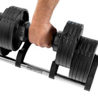 12kg Segment being lifted from 32kg Adjustable Dumbbell 