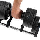20kg Segment being lifted from 32kg Adjustable Dumbbell 